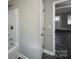 Fresh bathroom with shower-tub combo, and new neutral paint at 1408 Linwood Rd, Gastonia, NC 28052