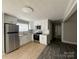 Bright kitchen featuring stainless steel appliances and abundant cabinet space at 1408 Linwood Rd, Gastonia, NC 28052