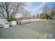 House exterior with gravel driveway and gated entrance at 162 Dogwood Cir, New London, NC 28127