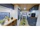 Bright eat-in kitchen featuring stainless appliances, laminate floors, and a garden view at 162 Dogwood Cir, New London, NC 28127