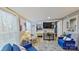 Open-concept living area featuring a TV, view to bedroom, and stylish furnishings, offering cozy living at 162 Dogwood Cir, New London, NC 28127