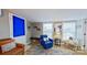 Cozy living room featuring bright window light, wood laminate flooring, and inviting decor accents at 162 Dogwood Cir, New London, NC 28127