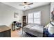 Cozy bedroom with hardwood floors, modern decor, and natural light from the shuttered windows at 215 Wesley Manor Dr, Matthews, NC 28104