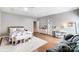 This large bedroom features a queen bed, hardwood floors, lots of space, and natural lighting at 215 Wesley Manor Dr, Matthews, NC 28104