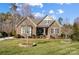 Charming brick home with a well-manicured lawn and inviting curb appeal at 215 Wesley Manor Dr, Matthews, NC 28104