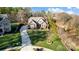 Beautiful exterior of a two-story home featuring a well-manicured lawn and a long driveway at 215 Wesley Manor Dr, Matthews, NC 28104