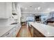 Open kitchen with a center island, stainless steel appliances, and a view of the living area at 215 Wesley Manor Dr, Matthews, NC 28104
