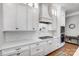 Well-designed kitchen with white cabinets, stainless steel appliances, and a gas cooktop at 215 Wesley Manor Dr, Matthews, NC 28104