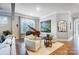 Cozy living room featuring a grand piano, comfortable seating, and elegant decor at 215 Wesley Manor Dr, Matthews, NC 28104