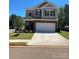 Two-story home featuring a two-car garage, brick and siding, and manicured lawn at 2202 Catawba Trace Dr, Catawba, NC 28609