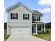 Charming two-story home features a two-car garage and inviting front porch at 2223 Catawba Trace Dr, Catawba, NC 28609