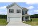 Charming two-story home featuring a two-car garage, classic shutters, and a well-manicured lawn, inviting curb appeal at 2223 Catawba Trace Dr, Catawba, NC 28609