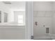 Bright laundry area with wire shelf storage solutions near the staircase at 2223 Catawba Trace Dr, Catawba, NC 28609