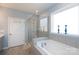 Well-lit bathroom with a soaking tub, a glass-enclosed shower, and stylish fixtures at 2296 Idol Rock Dr, Indian Land, SC 29707