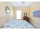 Cozy bedroom with a decorative mirror and bed that is covered in a bright and decorative quilt at 2296 Idol Rock Dr, Indian Land, SC 29707