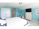 Comfortable bedroom featuring calming blue walls, a cozy chair, and natural light at 2296 Idol Rock Dr, Indian Land, SC 29707