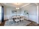 The dining area has a wooden table, seating for six and stylish decor, perfect for entertaining guests at 2296 Idol Rock Dr, Indian Land, SC 29707