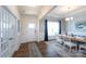 Bright dining room with elegant chandelier, large window, and stylish furniture that creates an inviting ambiance at 2296 Idol Rock Dr, Indian Land, SC 29707