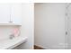 Bright hallway with built-in desk and white cabinets; perfect for organization and extra storage at 2296 Idol Rock Dr, Indian Land, SC 29707