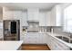 Modern kitchen boasts stainless steel appliances, white cabinetry, and lots of countertop space at 2296 Idol Rock Dr, Indian Land, SC 29707