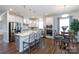 Spacious kitchen with stainless steel appliances, large island, and adjacent breakfast area; perfect for Gathering gatherings at 2296 Idol Rock Dr, Indian Land, SC 29707