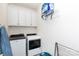 Functional laundry room with cabinets, modern washer and dryer, and practical storage solutions at 2296 Idol Rock Dr, Indian Land, SC 29707