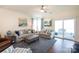 Bright living room with two sofas, an ottoman, and sliding glass doors to the patio at 2296 Idol Rock Dr, Indian Land, SC 29707