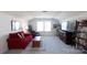 Large living room that includes couches, a large television and bookcase at 2296 Idol Rock Dr, Indian Land, SC 29707