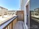 Balcony features wood railings and a view of the street and nearby buildings at 2610 Greenmarket Dr, Charlotte, NC 28217