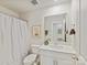 Bright bathroom featuring a vanity with a quartz countertop, modern fixtures, and minimalist décor at 2610 Greenmarket Dr, Charlotte, NC 28217