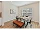 Bright dining area features a modern table setting, complemented by natural light from the windows at 2610 Greenmarket Dr, Charlotte, NC 28217