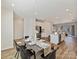 Open dining area offering a modern table setting, seamless access to the kitchen, and ample space for entertaining at 2610 Greenmarket Dr, Charlotte, NC 28217