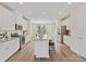 Bright, modern kitchen with white cabinets, granite countertops, stainless steel appliances, and island with seating at 2610 Greenmarket Dr, Charlotte, NC 28217