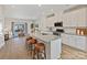 Modern kitchen features an island with seating, granite countertops, and stainless steel appliances at 2610 Greenmarket Dr, Charlotte, NC 28217