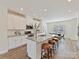 Bright kitchen with stainless steel appliances and a large island with bar stool seating at 2610 Greenmarket Dr, Charlotte, NC 28217