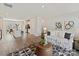 Open-concept living room with modern decor, a patterned rug, and seamless access to the kitchen and dining area at 2610 Greenmarket Dr, Charlotte, NC 28217