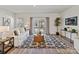Bright living room with sliding glass doors, stylish rug, and comfortable seating, filled with natural light at 2610 Greenmarket Dr, Charlotte, NC 28217