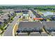 Overhead view of neighborhood street with community pool, pond, and townhomes at 2635 Winter Thistle Wy at 2635 Winter Thistle Way, Indian Land, SC 29707