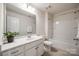 Bathroom featuring a white vanity, toilet, and shower-tub combo at 2635 Winter Thistle Way, Indian Land, SC 29707
