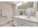 Bright bathroom with double sinks, a large mirror, and a shower behind glass at 2635 Winter Thistle Way, Indian Land, SC 29707