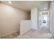 Upstairs hallway with carpet and view to the bedrooms at 2635 Winter Thistle Way, Indian Land, SC 29707