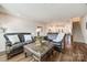 Spacious living room with hardwood floors, open to kitchen and stairs at 2635 Winter Thistle Way, Indian Land, SC 29707