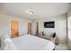 Main bedroom featuring an ensuite bathroom, a chaise lounge, and a TV at 2635 Winter Thistle Way, Indian Land, SC 29707