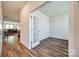 An office space with wood-look floors, neutral walls, and a glass paneled door for ample natural light at 2635 Winter Thistle Way, Indian Land, SC 29707