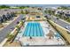 Aerial view of a community pool with sunning deck and lounge seating in a neighborhood with townhomes at 2635 Winter Thistle Way, Indian Land, SC 29707