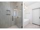 Modern bathroom with a glass-enclosed shower, soaking tub, and stylish fixtures at 302 Lincoln St, Belmont, NC 28012