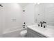 Modern bathroom with sleek vanity, updated fixtures, and tiled shower-tub, providing a spa-like experience at 302 Lincoln St, Belmont, NC 28012