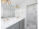 Modern bathroom with double vanity, sleek fixtures, and tub-shower combination, offering a luxurious experience at 302 Lincoln St, Belmont, NC 28012