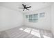 Bright bedroom with natural light, ceiling fan, and neutral carpet, creating a serene atmosphere at 302 Lincoln St, Belmont, NC 28012