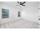 Well-lit bedroom with neutral carpet, double windows, and ample space, providing a comfortable retreat at 302 Lincoln St, Belmont, NC 28012